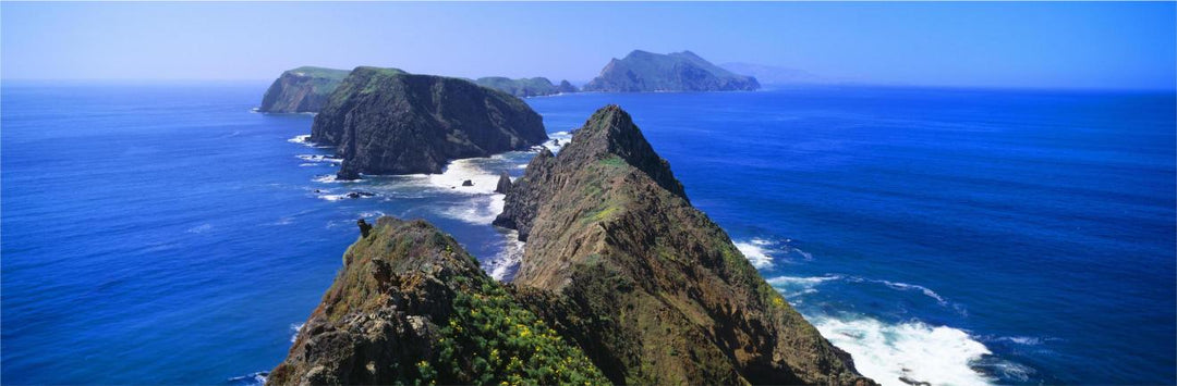 An overhead view of the California Channel Islands with rugged coasts and blue ocean waters.