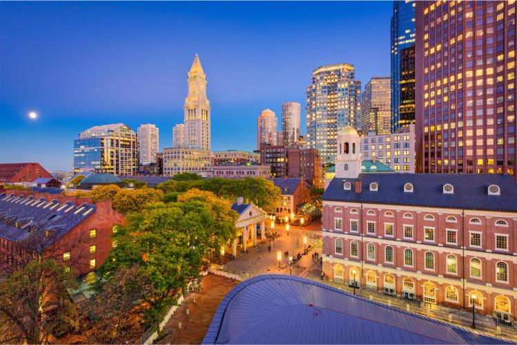 A photograph of Boston Massachusetts Downtown featuring several prominent buildings and the skyline.