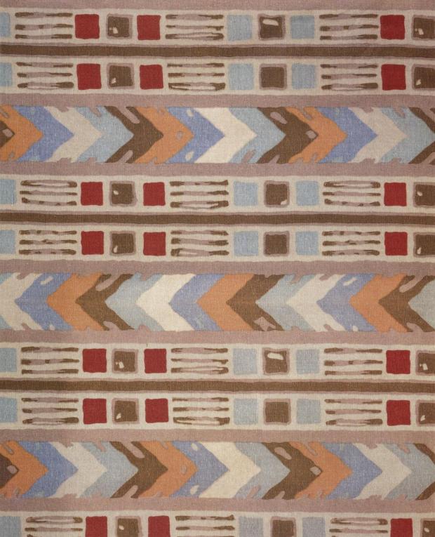 Patterned rug with geometric design in earthy tones