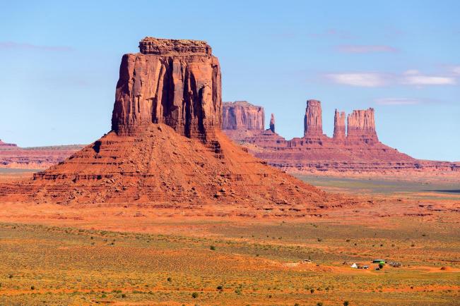 A landscape photo of Monument Valley Navajo Tribal Park with distinctive red rock formations in the background.