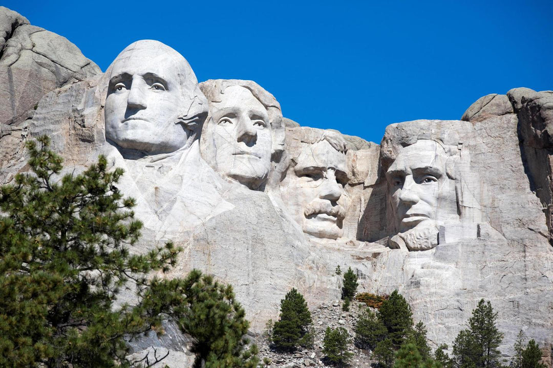 An image of Mount Rushmore featuring the carved faces of four former presidents of the United States.