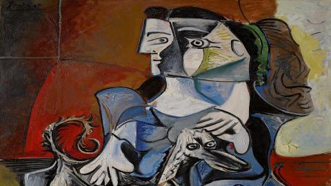 Abstract artwork with a stylized face and geometric shapes on a colorful background