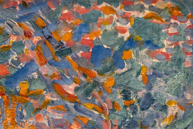 A detail of an abstract painting featuring geometric patterns in blue, orange, and various colors, indicative of modern abstract art.