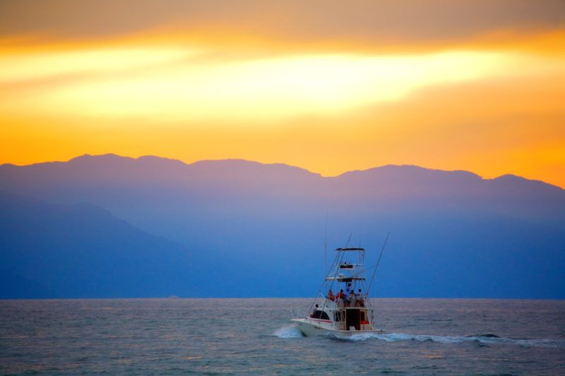Various Photographers - Fishing Boat at Sunset