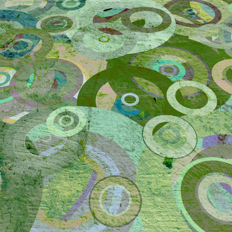 A close-up view of a decorative plaque with overlapping green circles of various sizes and shapes on a light background.