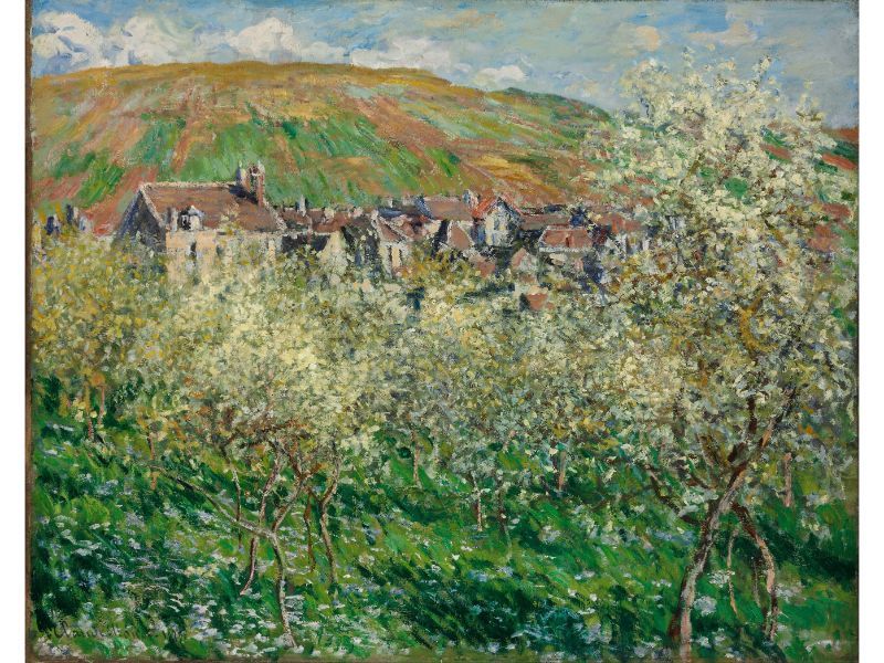 A painting featuring flowering plum trees with a village in the background, attributed to Claude Monet.